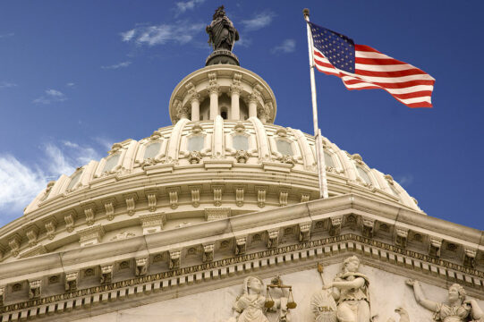 1024px-United_States_Capitol_Dome_and_Flag.jpg